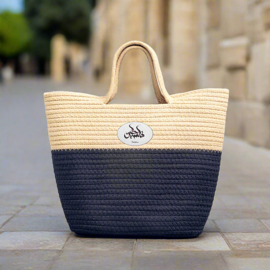 Handmade Woven Bag that is blue and beige with inscription "Palestine" in Arabic