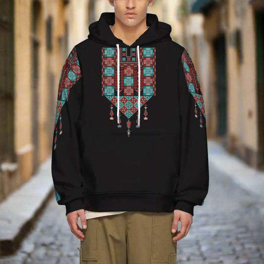 A man wearing a Palestinian Tatreez Print Hoodie that is Blue and Red, in the streets of jerusalem palesine