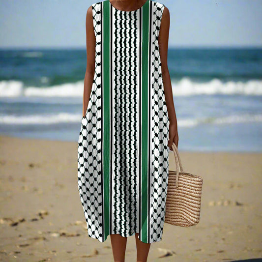 Woman wearing a sleeveless dress with geometric kuffiyeh pattern on a beach