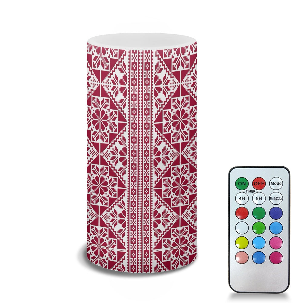 Decorative LED candle lamp with red and white tatreez palestinian pattern and remote control on a white background