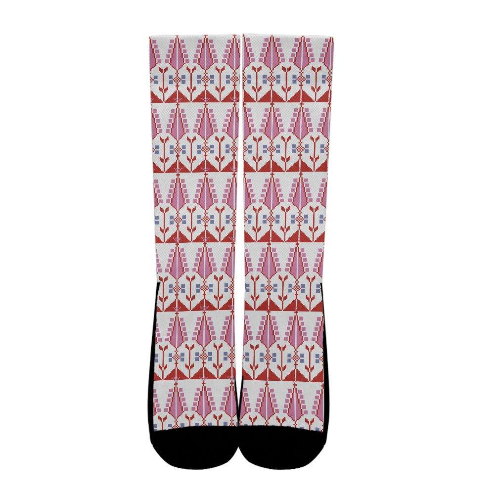 Socks with a tatreez pattern on a white background