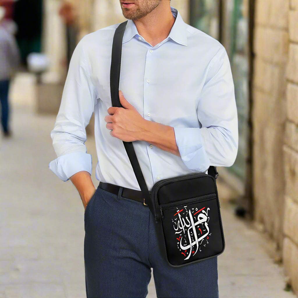 Man wearing a ramallah arabic calligraphy messenger bag