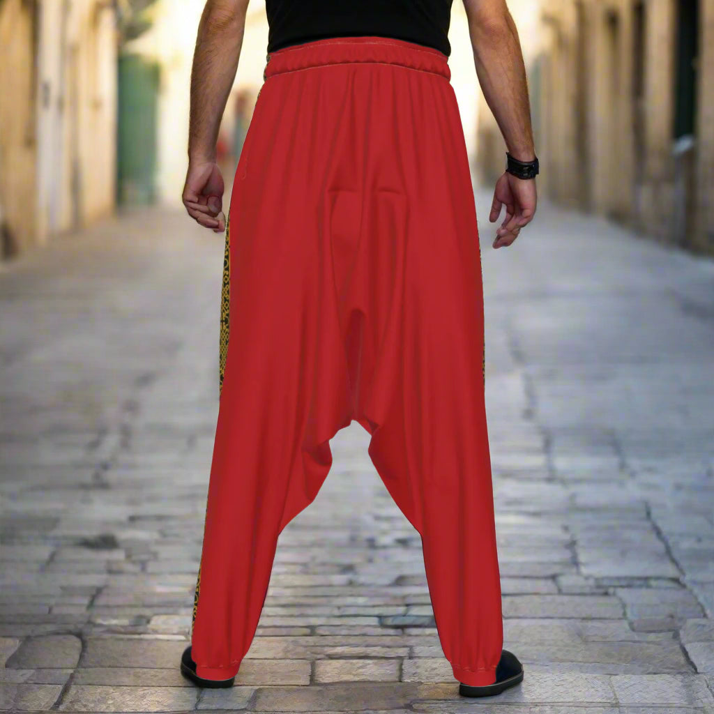 Man wearing a Palestinian Red Harem Sirwal Arabian Dabke Loose Pants in the streets of Jerusalem Palestine