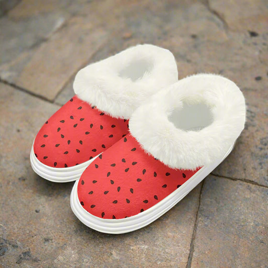 Red slippers with watermelon palestinian black seeds and white fuzzy interior on a white background
