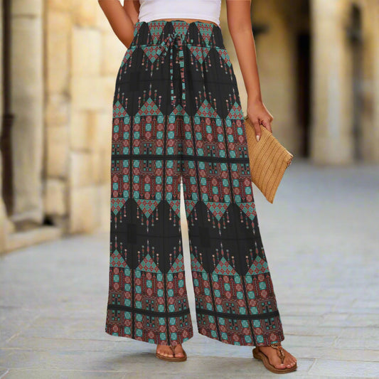 Person wearing patterned wide-leg pants with tatreez print