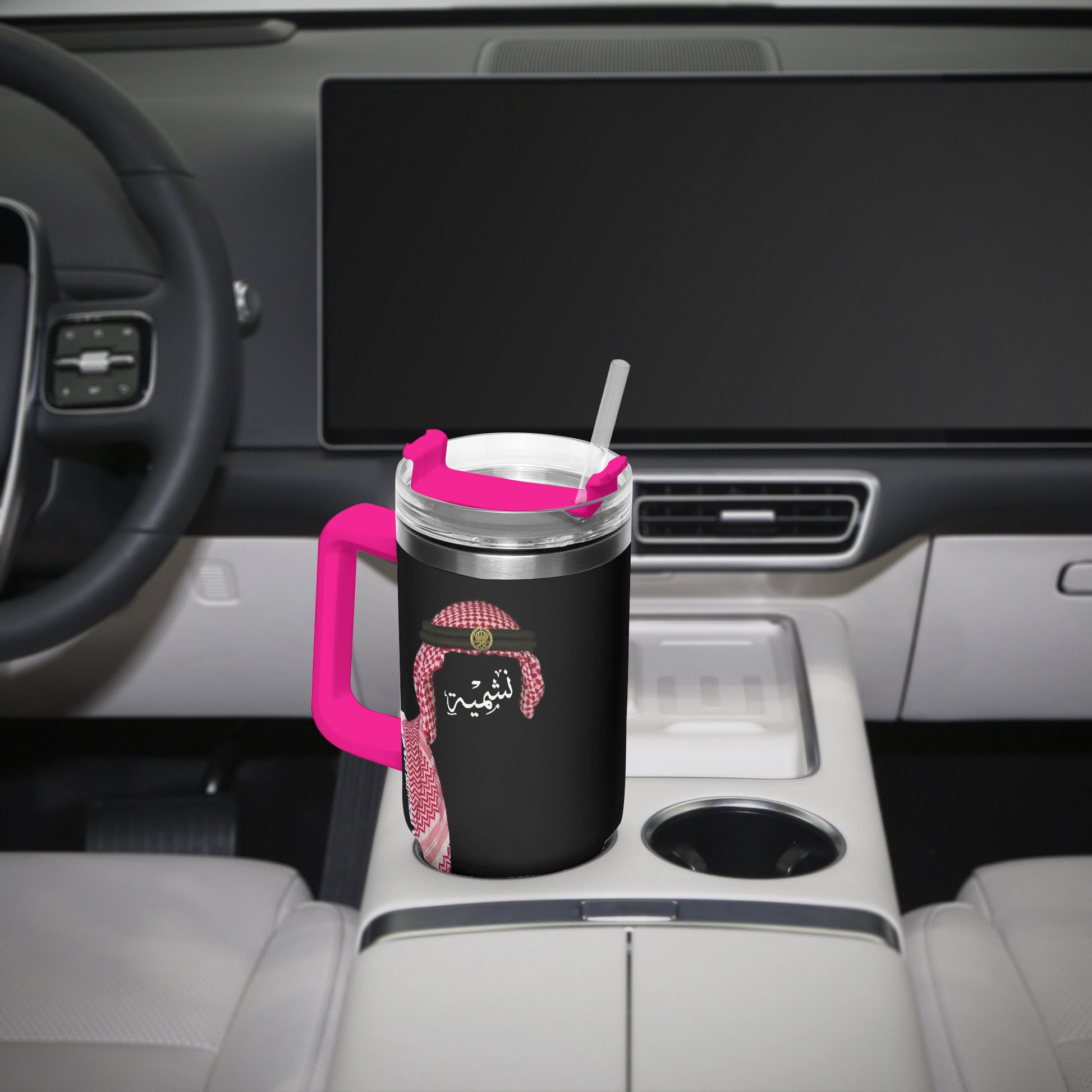 Jordanian Black mug with pink handle and lid on a car's cup holder