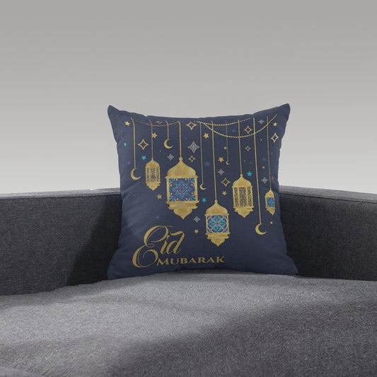 A Home Decor Arabian cushion with "Eid Mubarak" on it and Lanterns on a sofa. 